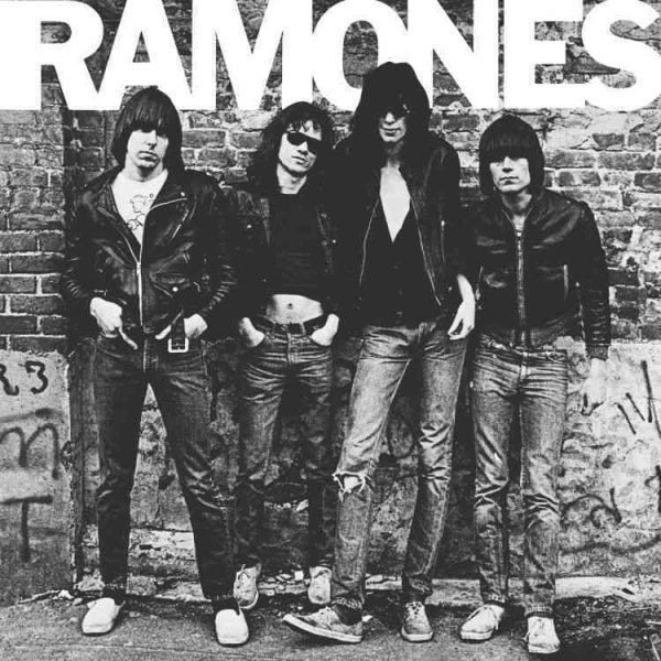 Punk Rock band the ramones standing in front of a brick wall